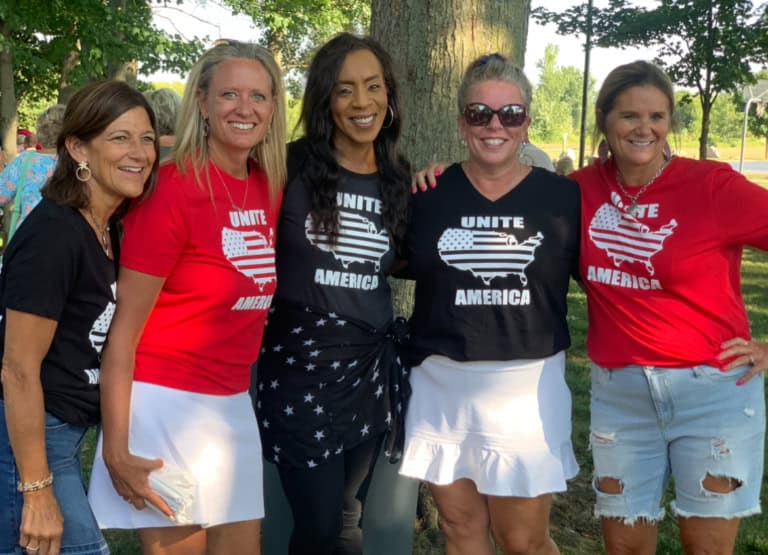 United States women’s Independence Day celebration with women wearing patriotic T-shirts.