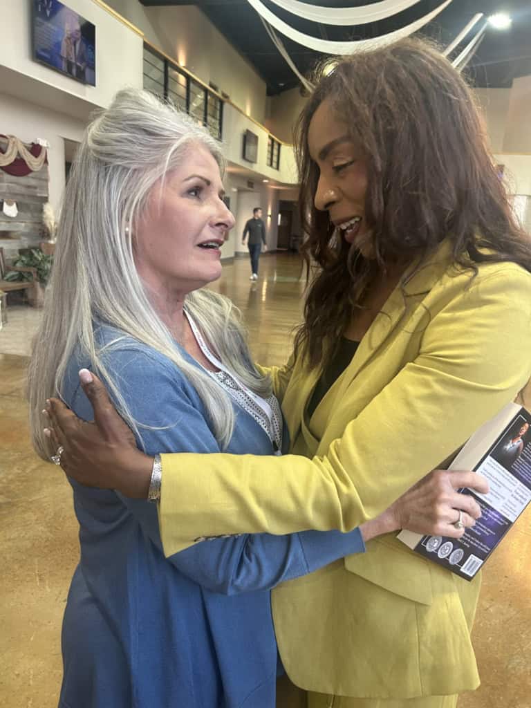 Bernadette Smith with supporter at volunteer event.